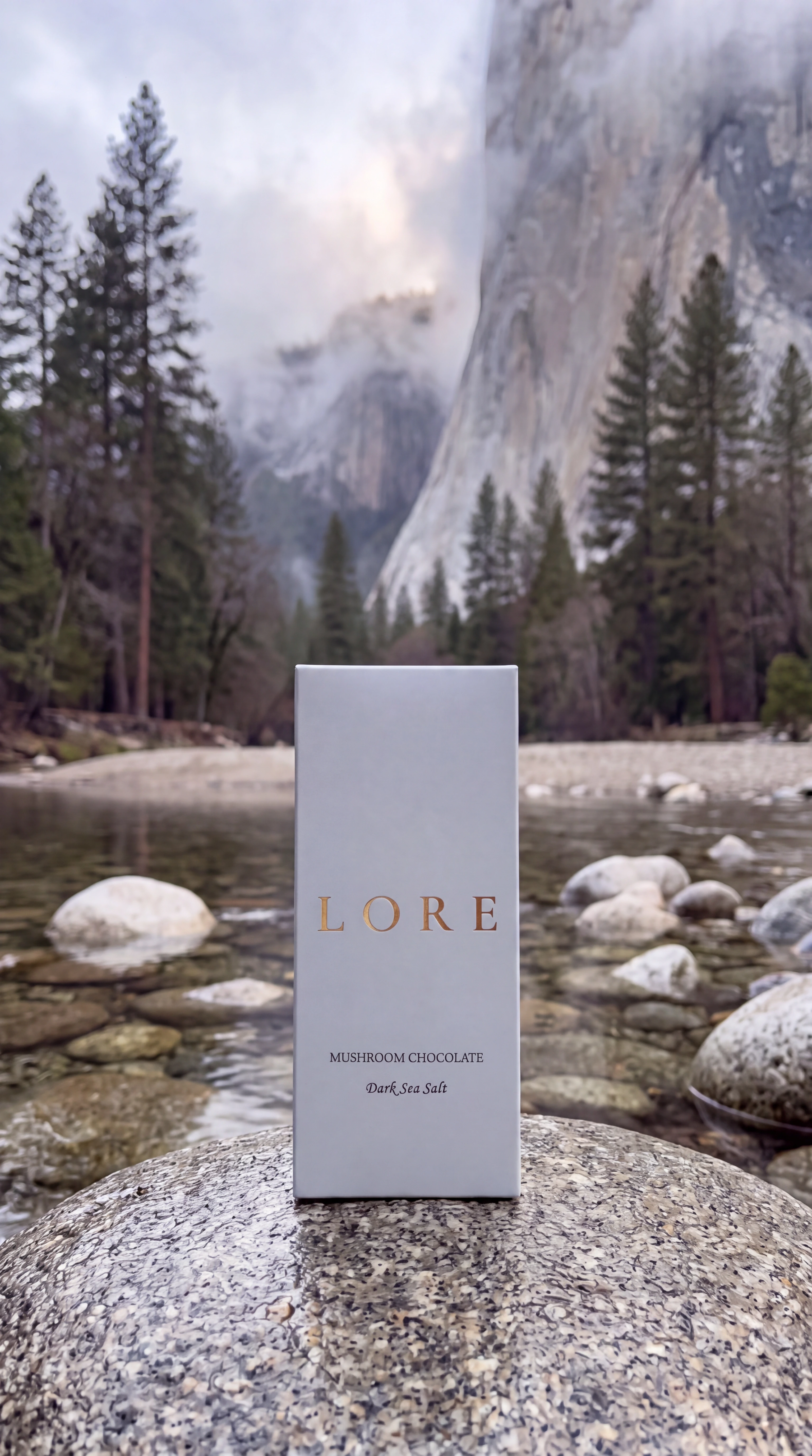 LORE bar standing on a Merced river stone beneath Yosemite granite